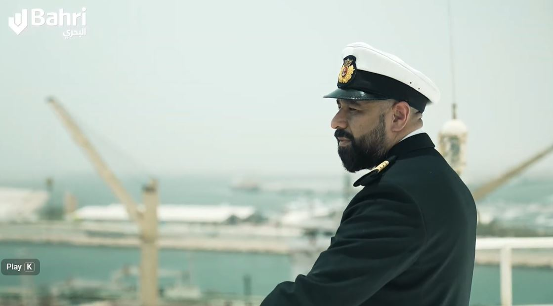 bahri-day-of-seafarers-2022-dubai-maritime-campaign.jpp A Bahri Seafarers captain overlooking the port during the Day of Seafarers 2022, honoring maritime workers in the global shipping industry.