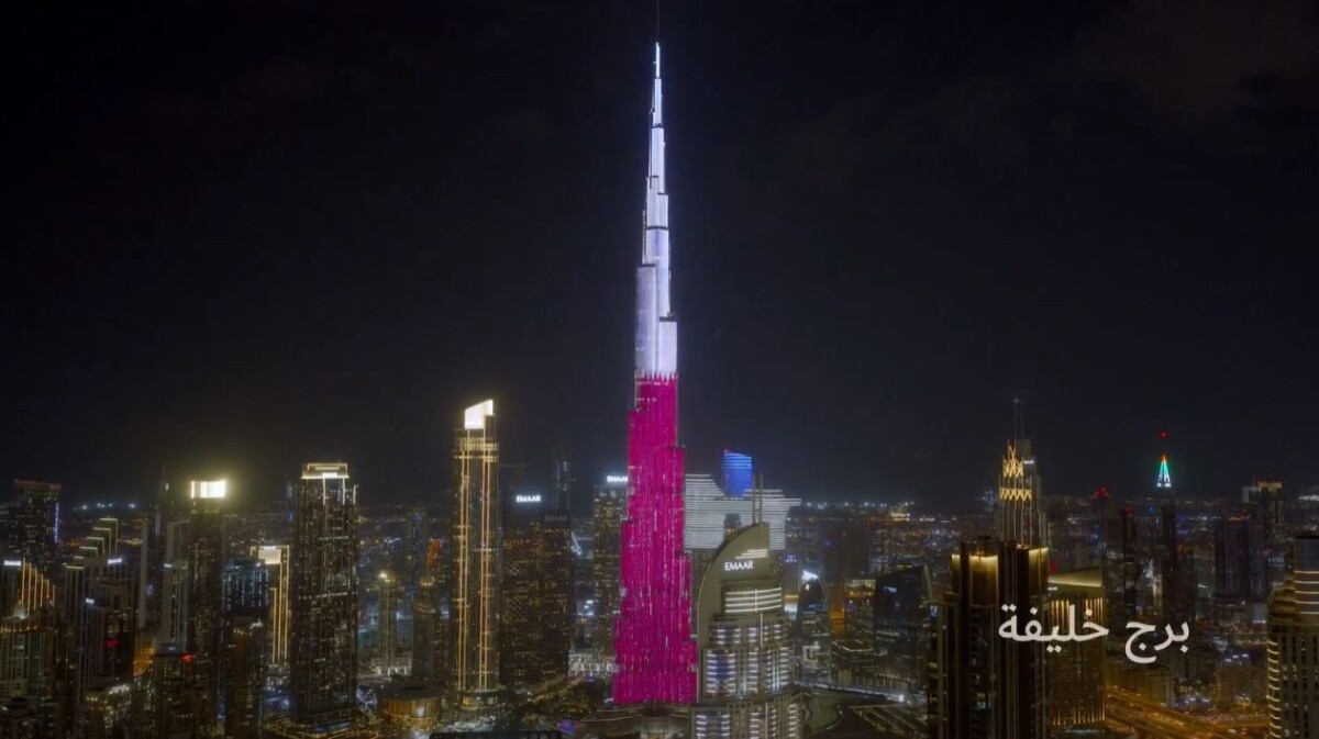 Burj Khalifa illuminated in red and white during Qatar National Day 2025, showcasing iconic skyline visuals captured through cinematic video production in Dubai