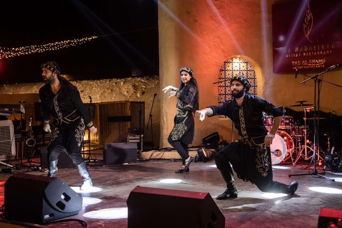 Cultural Event Production & Photography Coverage Event Production and Photography Services capturing a traditional live cultural dance performance with stage lighting and audience engagement