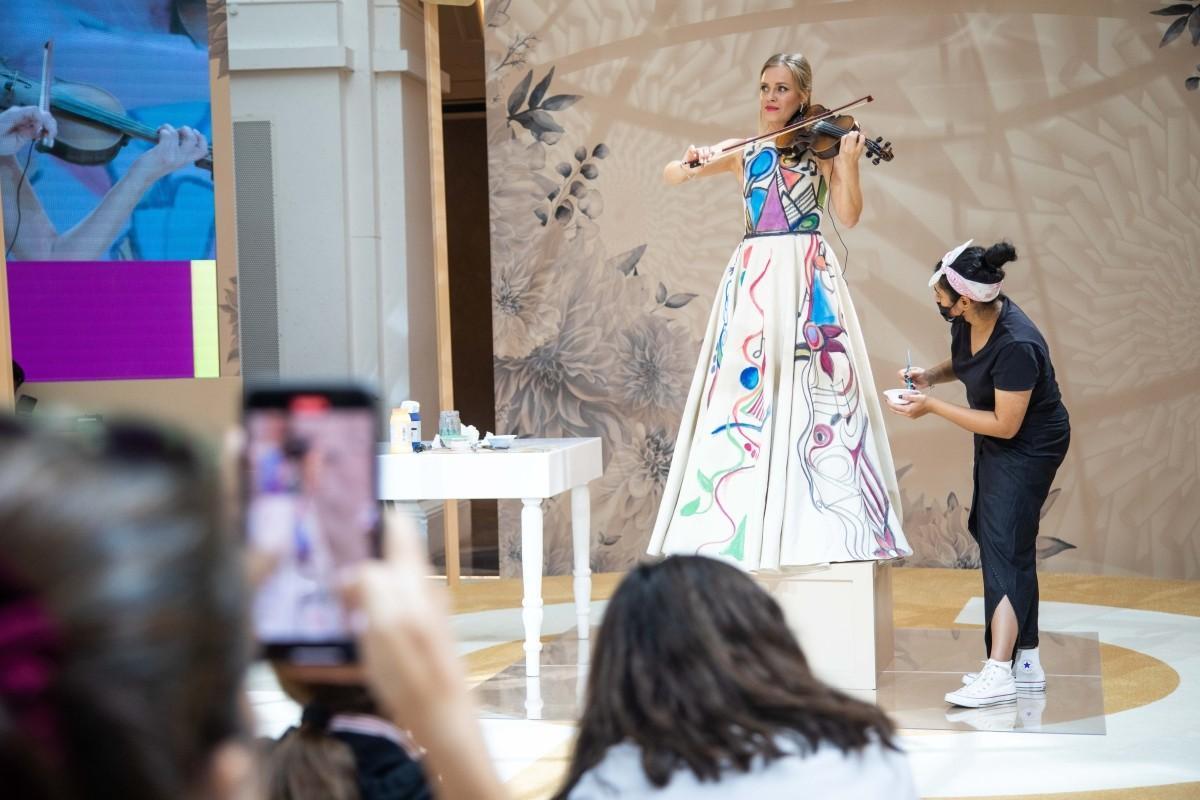 Creative Event Production & Photography Coverage Event Production and Photography Services capturing a live artistic performance with stage design, audience engagement, and professional coverage