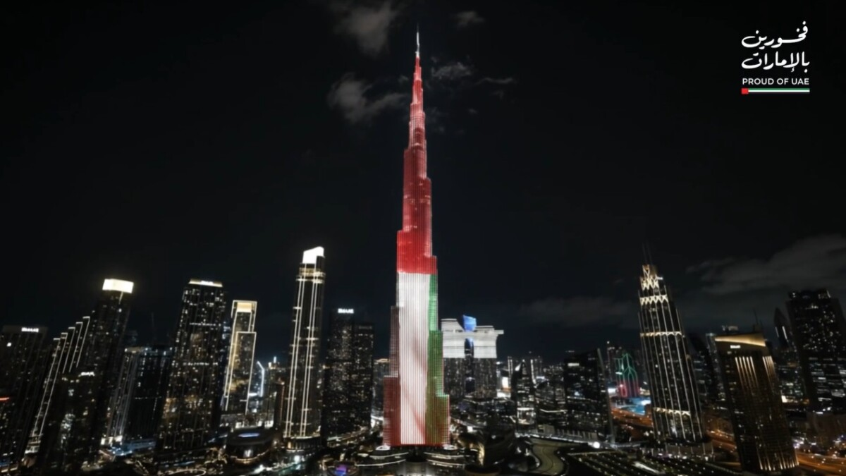 Burj Khalifa UAE Flag Lights Dubai Night Burj Khalifa illuminated in UAE Flag colors lighting up Dubai skyline at night